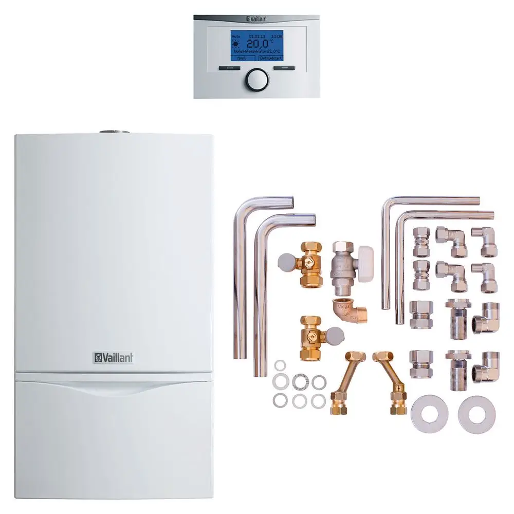 Vaillant Wandheizkessel mit digitalem Thermostat, umgeben von Rohrleitungen und verschiedenen Verbindungselementen. Zubehörteile sind ebenfalls im Bild sichtbar.